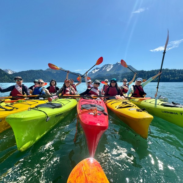 a group of people on a boat in the water
