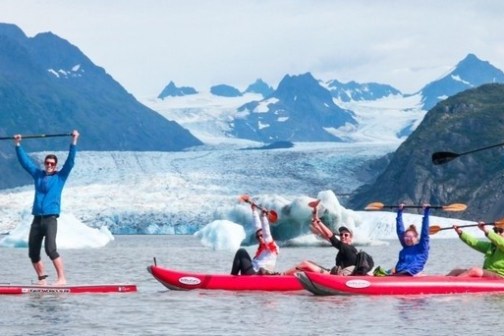 a group of people on a boat in the water